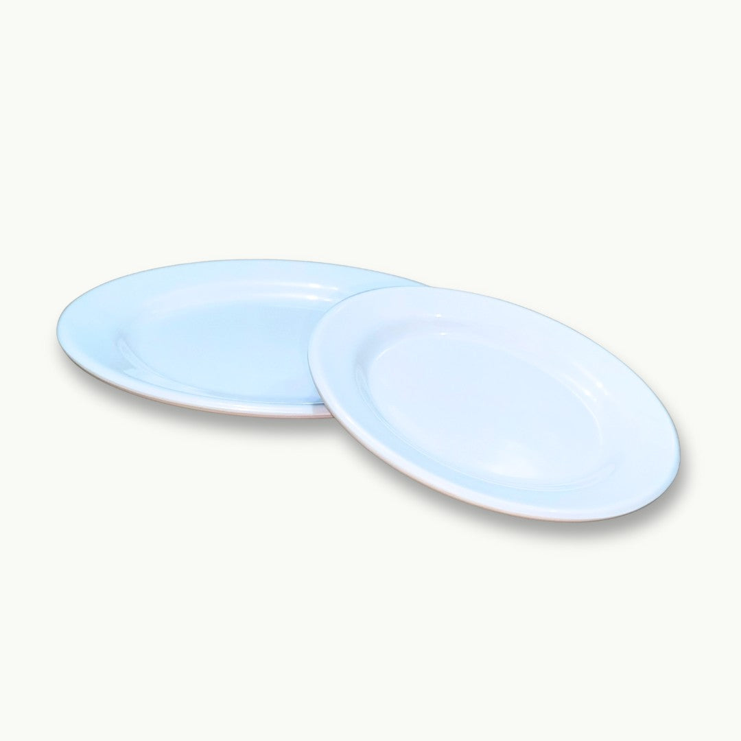 Set of premium white imported melamine plates by DineLux Pakistan.